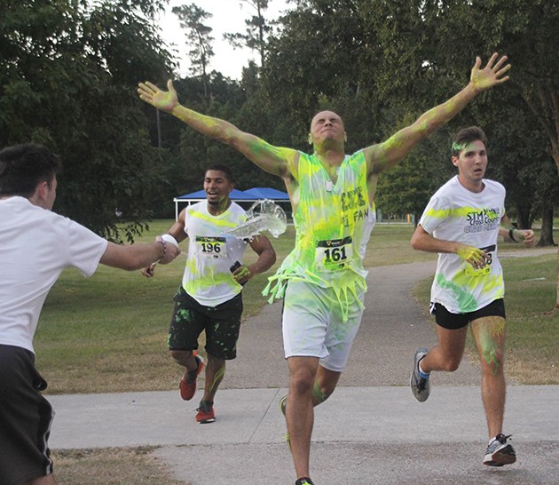 Participants of 5K paint run get messy