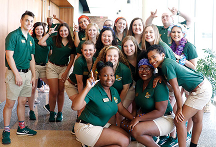 Orientation leaders pose together during an orientation week. Assigned to a color group, the incoming freshmen follow their orientation leader to learn more about the university. During each orientation week, the orientation leaders worked to build up lion pride and teach incoming freshmen about the university.