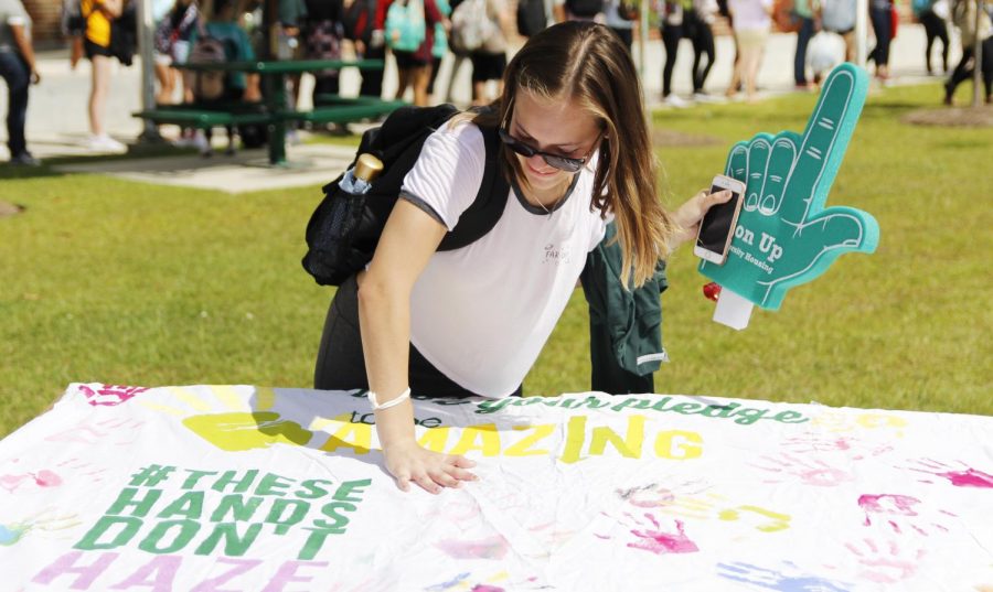 At last year’s “Gumbo Ya Ya,” students participated in painting a “These Hands Don’t Haze” sheet sign.