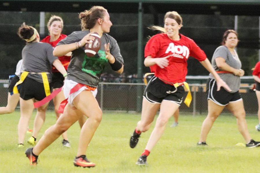 Morgan Foret, Alpha Sigma Tau quarterback, rolls out to the right in her teams flag football match.