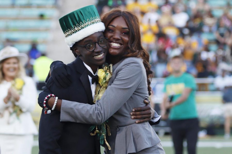 2018 Homecoming King Cedric L. Dent, a senior social work major, and 2018 Homecoming Queen Da’Jon Beard, a junior early childhood education major, hug on the field after having their names called as the new king and queen.