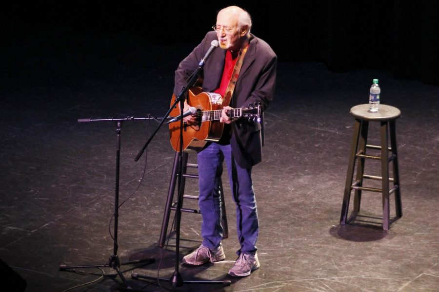 Peter Yarrow sings on the stage of the Columbia Theatre.