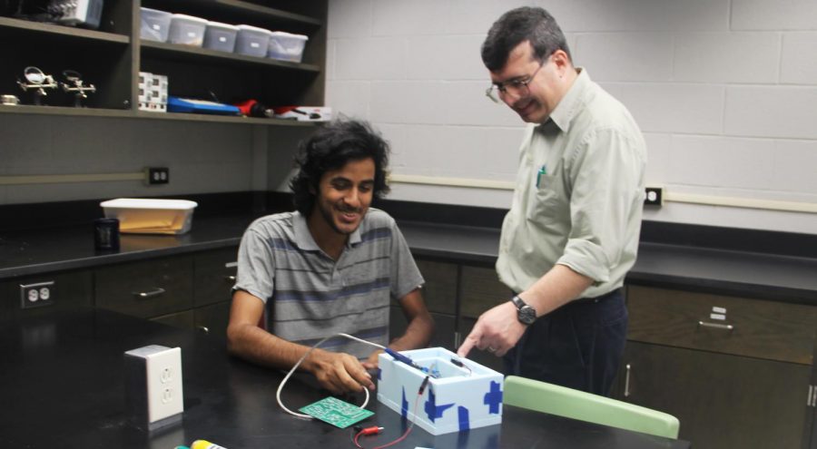 Damodar Dahal, a senior majoring in mathematics, physics and computer science, and Professor of Physics Dr. Gerard Blanchard work on Project ROOMIE 1. 