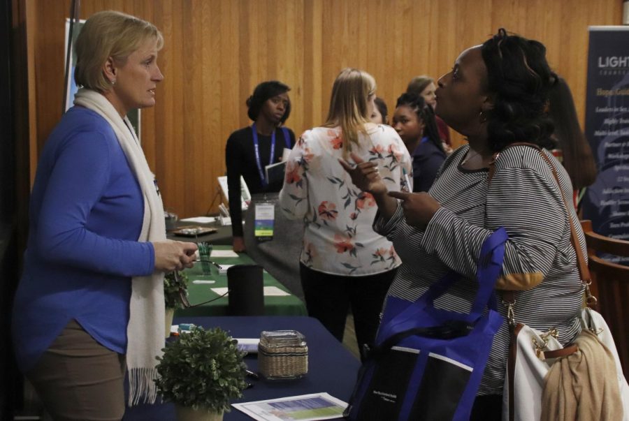 Sherry Chaney, a licensed clinical social worker for Lifeline Behavioral Health, left, speaks with other professionals in the field at the second annual Terrell Conference to build a community. This years conference included more time for attendees to network. 