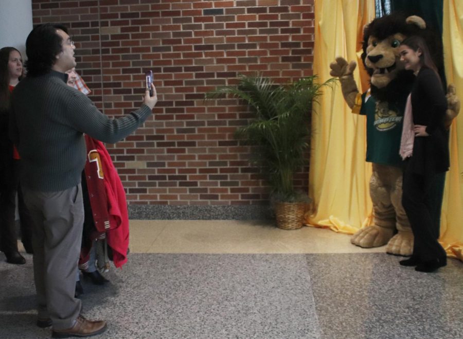 At the Scholars Showcase, attendees took photos with Roomie as they were welcomed to the university. The night consisted of informing the high school students and their families of the universitys campus and programs. 