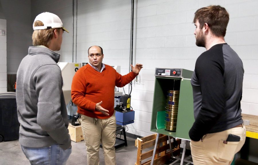Dr. Mohammed Zeidan, assistant professor of engineering technology, shows William Maley, a junior engineering technology major, and Christopher LeSage, a senior engineering technology major, the equipment used in the construction lab. Two students in the engineering technology program will receive a scholarship funded by a grant from Terracon.
