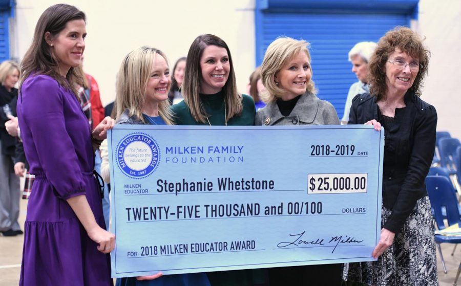 Hannah Dietsch, Louisiana assistant superintendent, Joni Lacy, talent project director for the Louisiana Department of Education, Stephanie Whetstone, Milken Educator Award recipient, Donna Edwards, Louisiana first lady, and Dr. Jane Foley, senior vice president of the Milken Educator Awards, pose at the presentation of the oversized $25,000 check to Whetstone. 