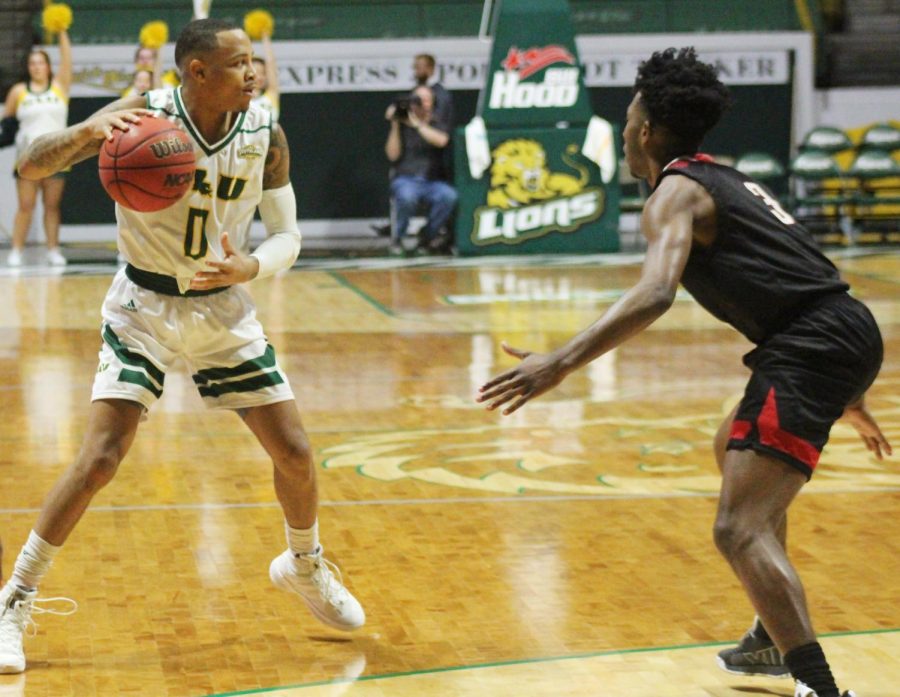 Marlain Veal, senior guard, looks for an open pass in Saturdays game against Nicholls State University. The Lions beat the Colonels 91-70.