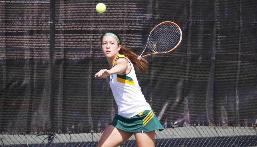 Ceci Mercier, a senior on the tennis team, watches the ball in a match against McNeese State University. Daniel Anders, coach of the Tennis Club, looks to build a sports club for tennis on campus. 