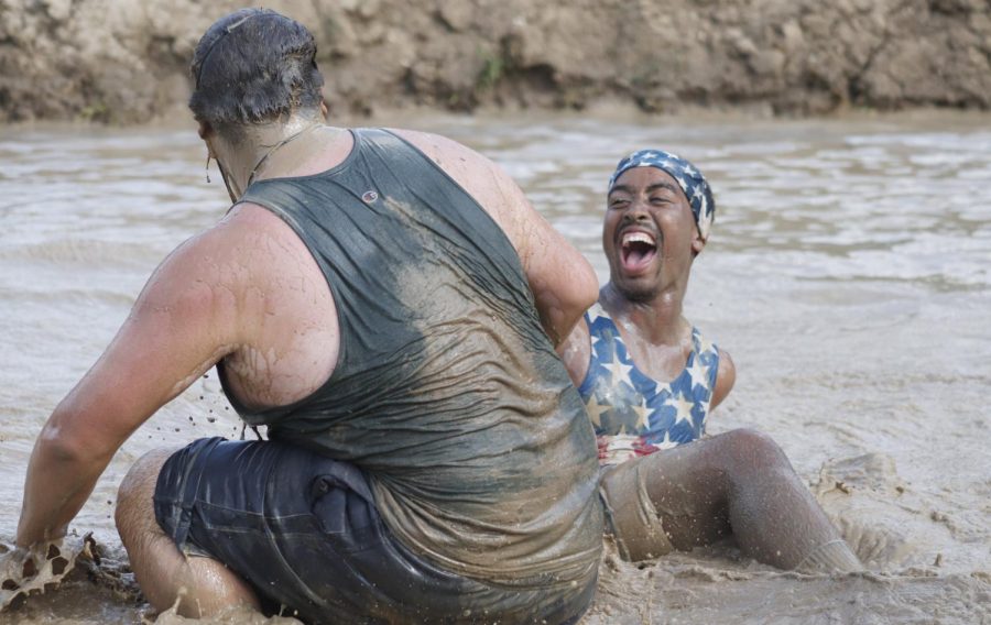Students enjoy themselves and bond while participating in “Swamp Bowl.” The mud volleyball tournament is hosted each year outside the Pennington Student Activity Center. 