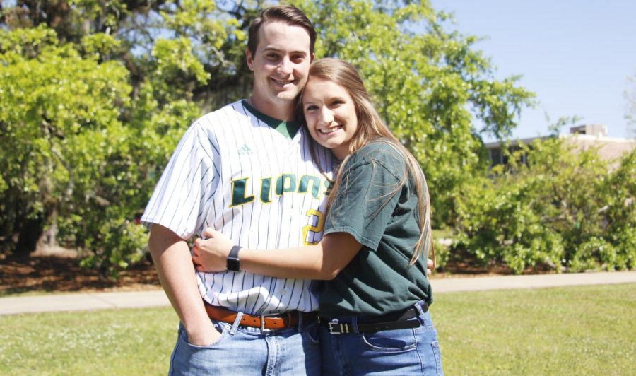 Carlisle Koestler, a senior pitcher, and Jenna Bordelon, a junior nursing major, pose for a picture in Friendship Circle. They   began dating about two years ago and have managed the time commitments of athletics. 