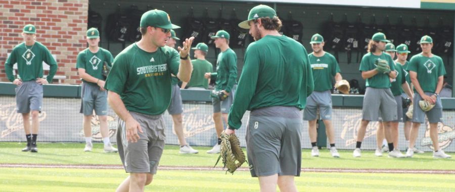 Kyle Schimpf, a senior infielder, works with one of the assistant coaches during practice. Schimpf, like many other graduating seniors, has made memories at the university during his time as a student athlete. 