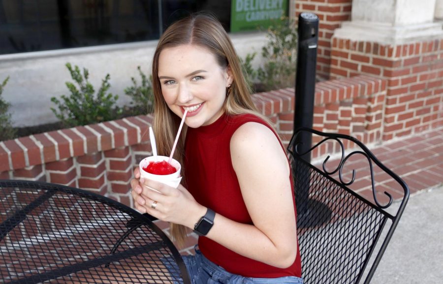 Miss Southeastern Louisiana University Chelsey Blank cools down with a snowball from Snow Bros in downtown Hammond. It is important to stay hydrated during the hot summer months according to Dr. Ryan Green,  assistant professor of athletic training.