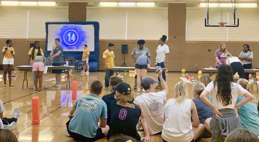 Contestants participate in a game where they sort M&Ms by color. All students were welcome to attend Minute to Win It.