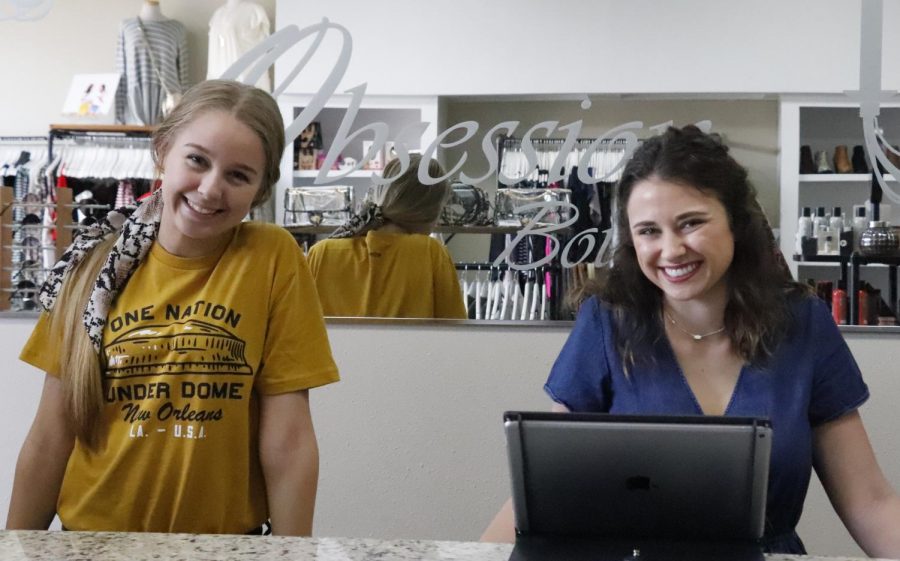 Obsession Boutique has won “Best Boutique” in Louisiana for 2019. Employees Adrienne Mclin and Madeline Lato, left to right, assist customers in preparing for “Game Day” outfits. 