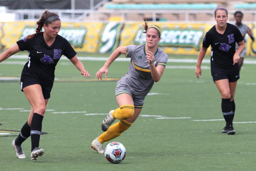 Freshman Avery Royer defends against a pass from Abilene Chrsitan in Sunday’s loss. The Lady Lion’s held the Wildcat’s to a single goal on Sunday. 