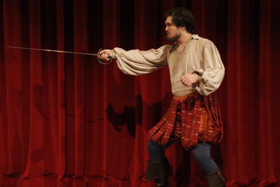 Tyler Meyer, a performer, uses sword during the play Strawberry, Guns, and Milk performed at the Vonnie Borden Theatre on Sept. 20, 2017.