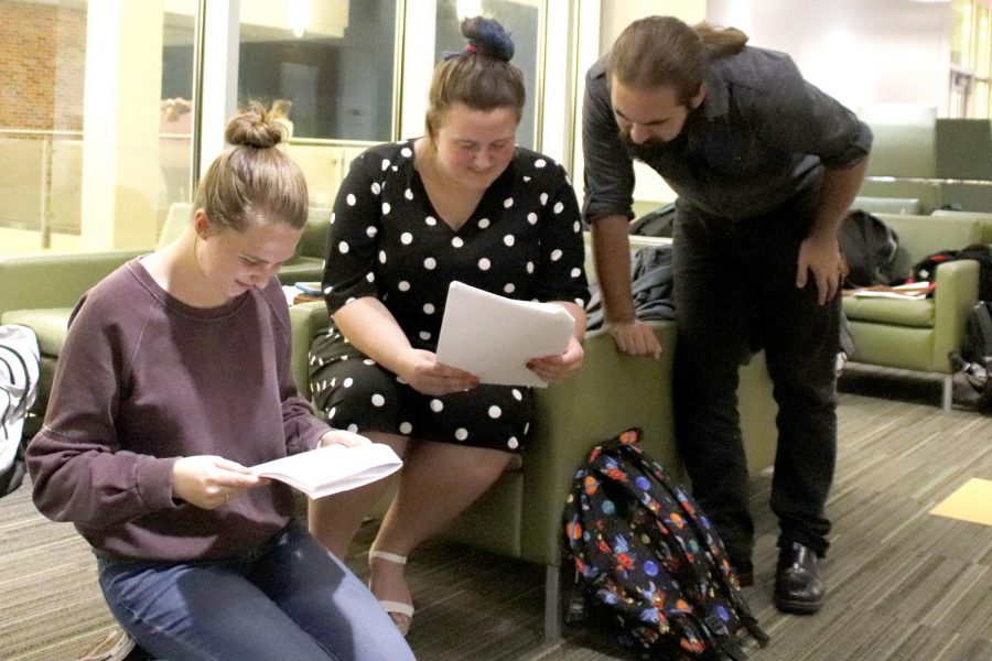 Kat Schepker, Shelby Grantham and Hayden Kimball review lines before a rehearsal. Many actors and actresses suggest practicing lines as a group to catch individual mistakes.