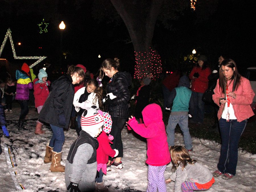 Young attendees enjoy the downtown Hammond lights and faux snow during the 2014 Starry November Night. 