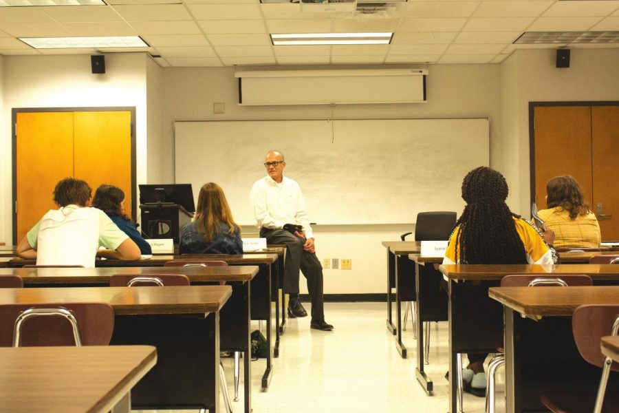 William Joubert, business center director and mentor of the YEA! Northshore, helps students develop their business ideas. The year-long program transforms students into young entrepreneurs. 