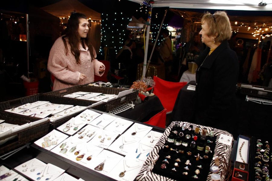 A customer talks with Videt Catania, co-owner of KatanYada. Catanias busniess sells jewelry made from rock that she and her husband collect.