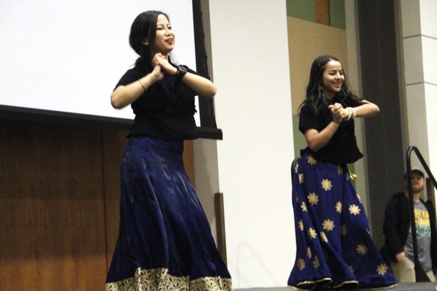 Chandani Gurung, a junior computer science major, and Sabina Sitaula, a senior finance major, dance on a Nepali song during International Night Celebration.
