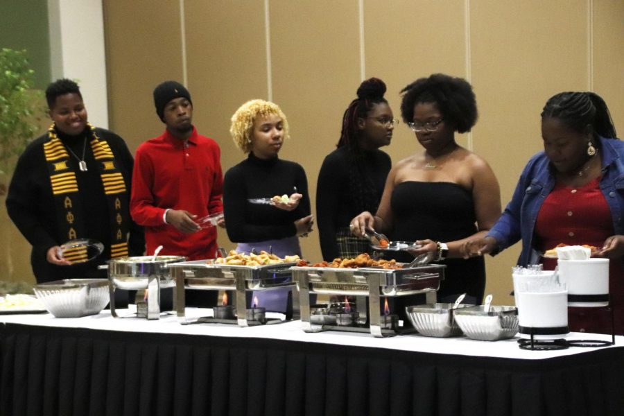 Participants enjoy food during the MISA Holiday Celebration. The event was hosted on Dec. 5 and recognized students for their hard work and contribution to the university by handing awards.