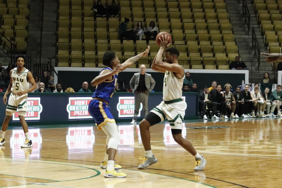 Junior forward Maxwell Starwood prepares to make a pass during the mens basketball game on Jan. 22. Starwood scored a career-high 17 points, earning the most points for the Lions during the game.