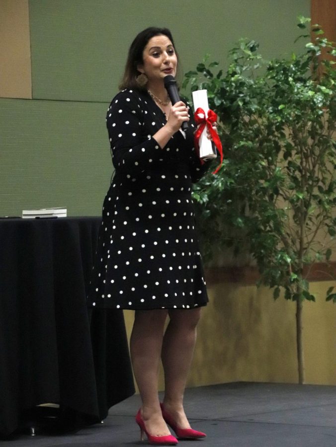 Dima Ghawi, an author and a leadership keynote speaker, speaks to the audience during Passport to Leadership.
