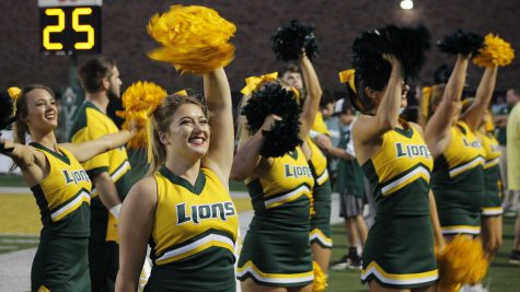 Junior Kristine Stubbs cheers on the Lions in a 2019 football game. Cheer clinics will be hosted on March 22 also on April 5 and 22.
