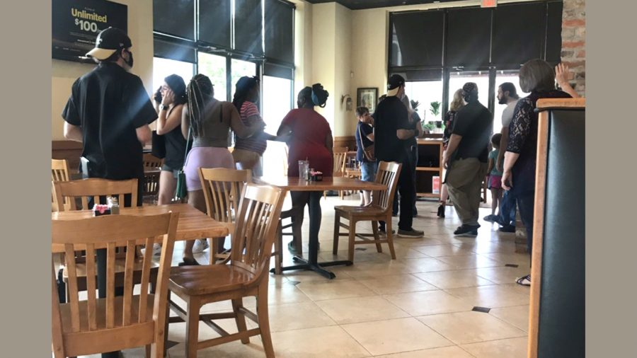 Shoppers at Hammond Square shelter at Albasha restaurant after a suspect drove through the Target shopping center. The suspect was later identified as Walter Allbritton III, 41, of Ponchatoula.