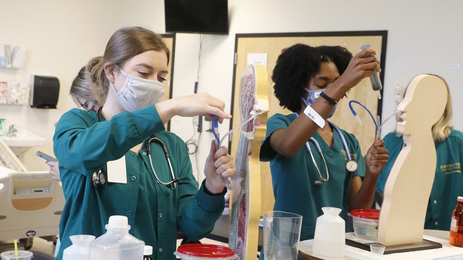 Nursing students complete activities in the lab. The nursing field covers a wide range of professions, from direct patient care to nursing informatics. 
