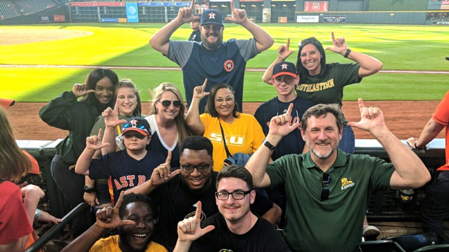 Members of the sport management  program pose for a picture while on a field trip a Houston Astros baseball game.