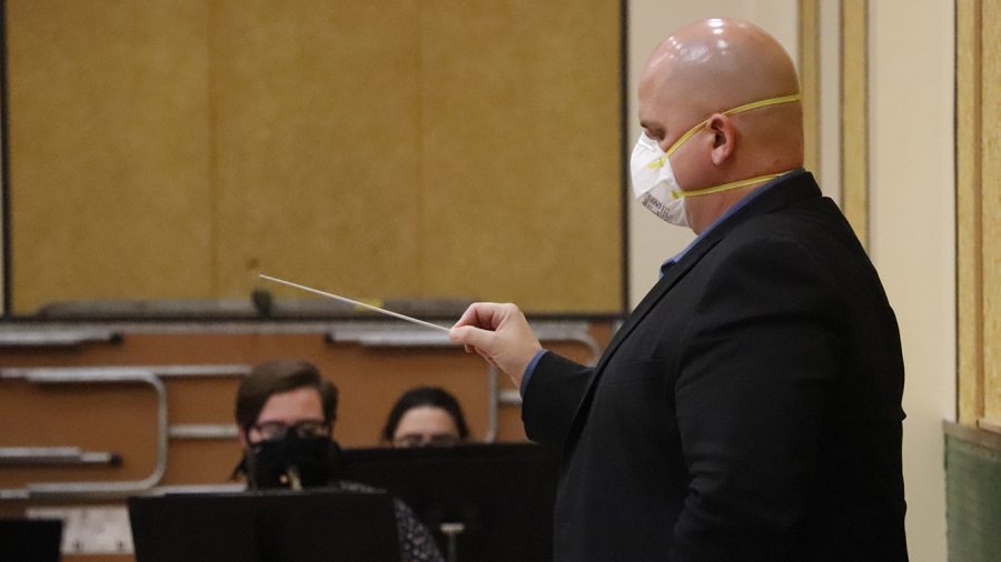 Wind Symphony director Victor Drescher leads a socially-distanced rehearsal. Drescher came to the university in 2013 and serves as an instructor of clarinet in addition to directing the Wind Symphony.