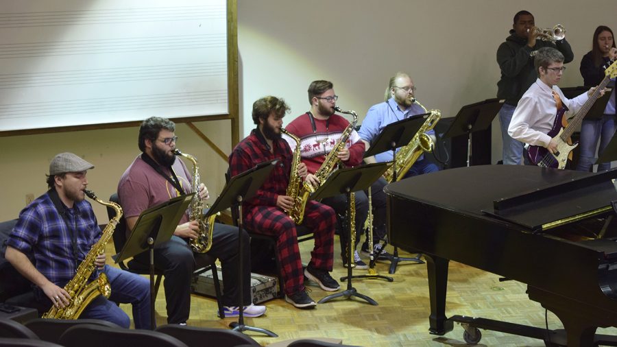 Some members of the jazz ensemble dressed up in Christmas apparel for rehearsal. The concert will be livestreamed from KSLU’s Facebook page and will feature Christmas songs such as “Christmas Time is Here,” “Deck the Halls,” “It Came Upon a Midnight Clear” and “Jingle Bells.” 