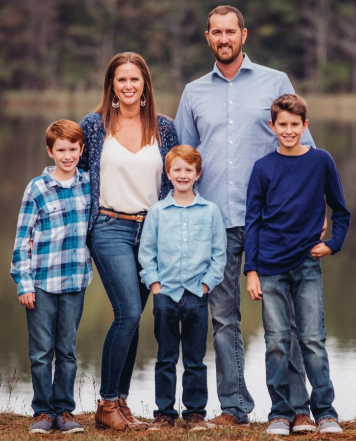 Jonathan “J.T.” Taylor poses for the camera with his wife and three sons. After earning a business degree from the university in 2005, Taylor eventually went on to become mayor of Livingston. 