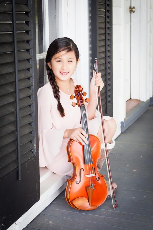 Alana Saenz, an 11-year-old musician, is the youngest member of the SLU Symphony Orchestra. 