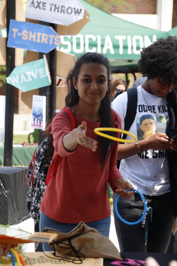 A student participates in a ring toss event at the 2019 Strawberry Jubilee celebration.