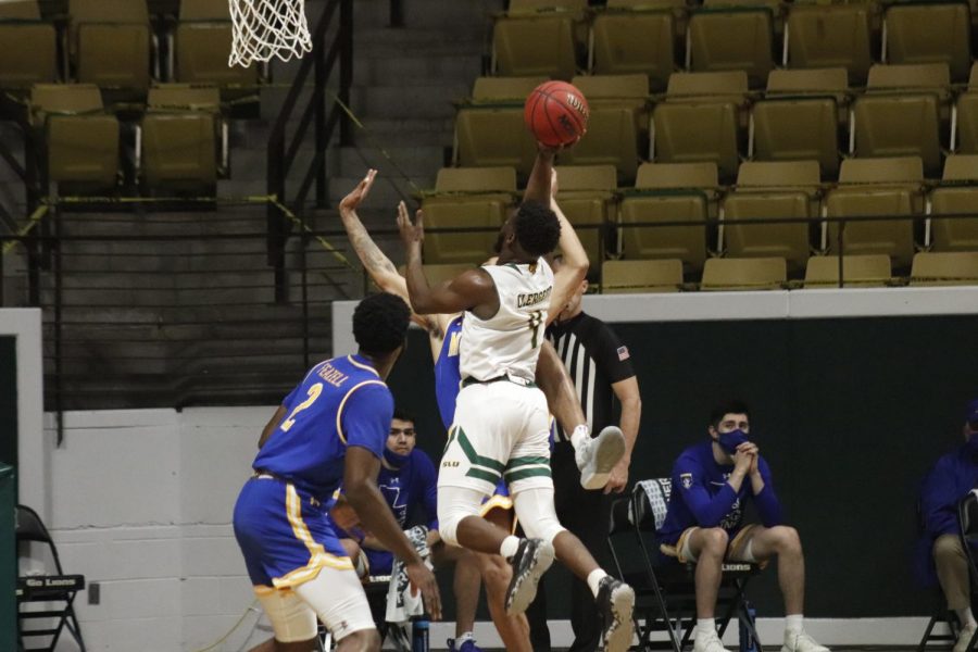 Senior guard Keon Clergeot pushes through the Cowboys defense and goes for a shot during the last home game of the 2021 season against McNeese State University on Feb. 24. 