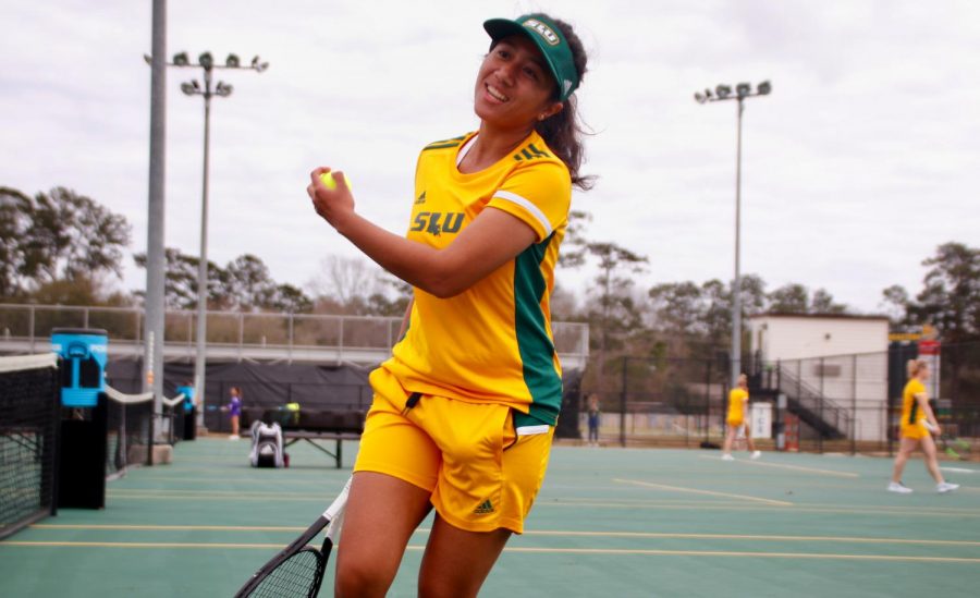 In the home opener on Feb. 21, sophomore tennis player Putri Insani, above, earned a 6-0 win in the doubles round with junior Ximena Yanez and a 6-3, 6-0 win in the singles round.