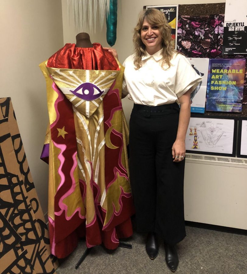 Christine Crook, assistant professor of costume design and make-up technology, shows off a costume she made in back 2019.