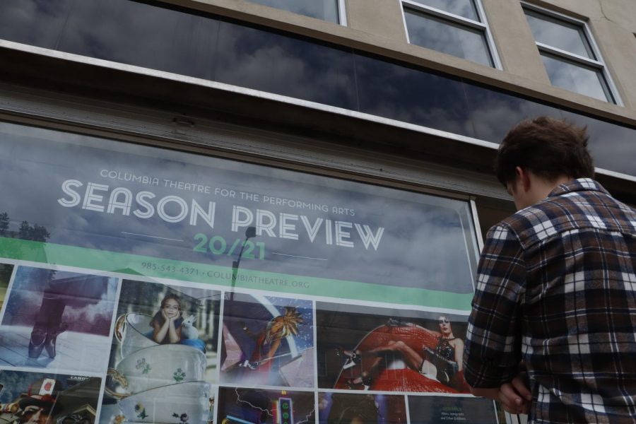 Sophomore psychology major and student actor Landon Scholle checks out the Columbia Theatre’s 2020-2021 season poster in the window of the building. The Columbia will be hosting Southeasterns Ragtime musical performances scheduled for September.