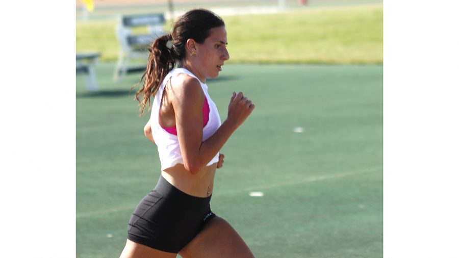 At track practice, Sophie Daigle tries to improve her times and form. She currently has the most records out of any single female track runner in university history.  