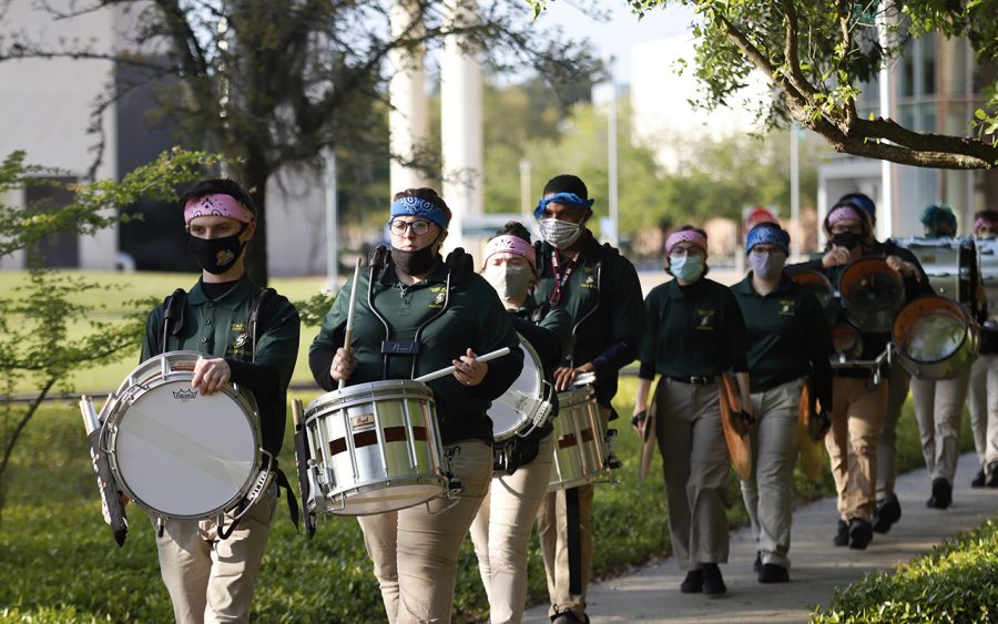 Band+members+perform+on+their+way+to+Strawberry+Stadium+as+the+Lions+football+team+faces+off+against+Northwestern+State.