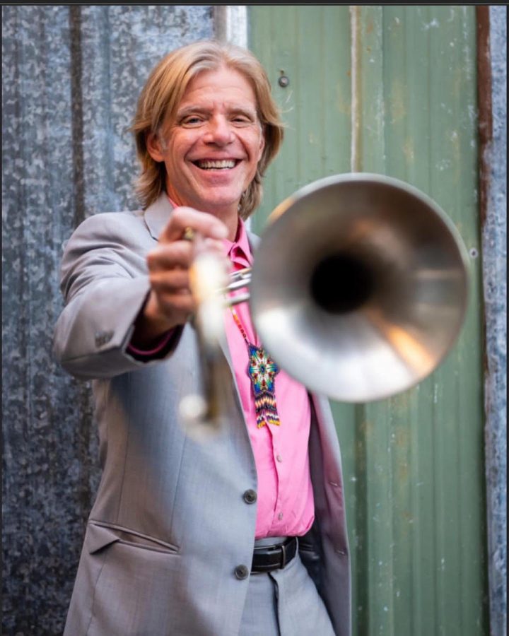 Mr. Klein posing for a solo photo with his trombone. The musician has been playing since he was in the 4th grade, essentially his entire life. 