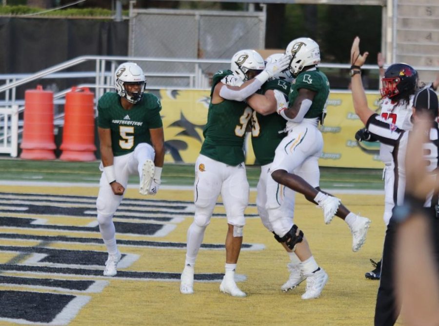 The Lions celebrate after scoring a touchdown in the April 3 football game versus Lamar University at Strawberry Stadium. Student-athletes around the country can now earn money for their name, image and likeness according to the recent NIL ruling from the NCAA.