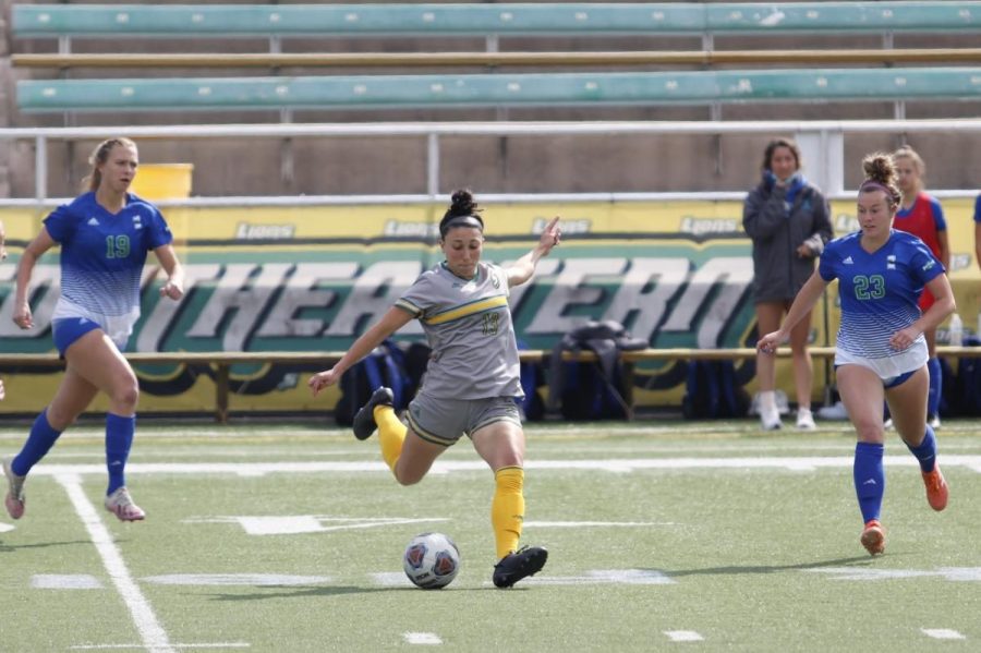 Midfielder Mya Guillory goes to kick the ball to another teammate in the April 3 game against Texas A&M Corpus Christi last season. The Lady Lions defeated the Islanders 3-1.