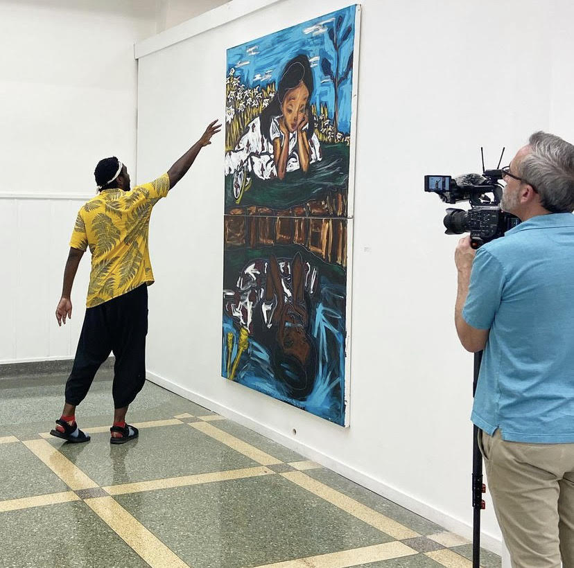 John Isiah Walton at the SLU Contemporary Art Gallery giving a tour of the exhibit as well as explaining the details of some of his pieces. Walton's work will be in the SLU gallery until September 2. 