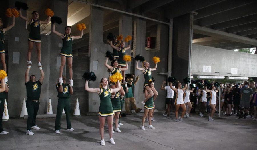 The Lionettes and cheerleaders hype up the crowd at Strawberry Jam in the parking garage. Strawberry Jam was moved from the field to the parking garage at Strawberry Stadium due to weather.