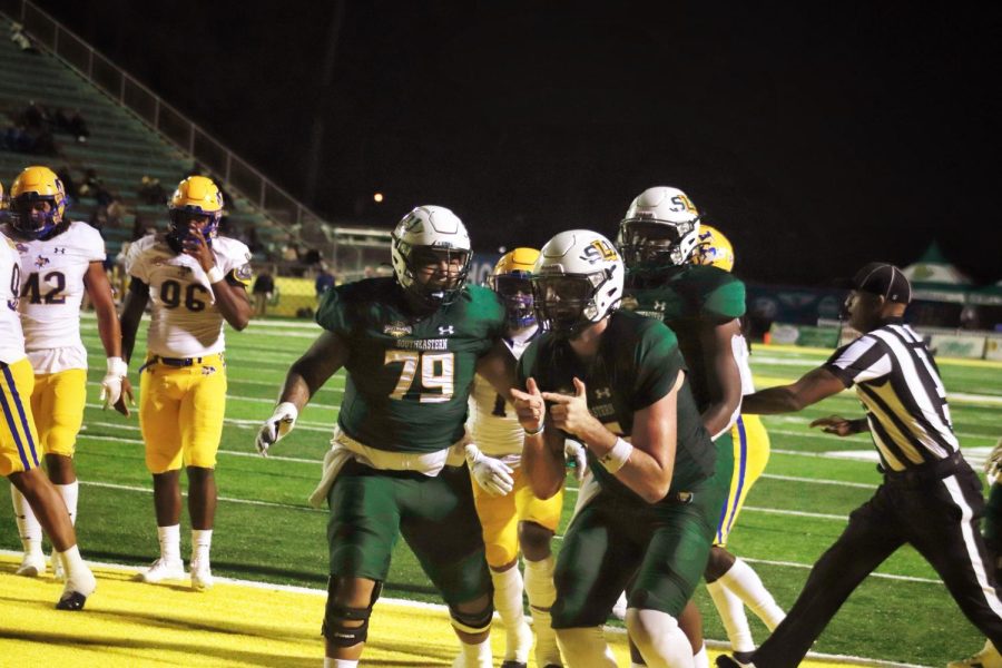 SLU+quarterback+Cole+Kelley+and+his+teammates+celebrate+after+scoring+a+touchdown+against+the+Cowboys+on+Saturday+night.